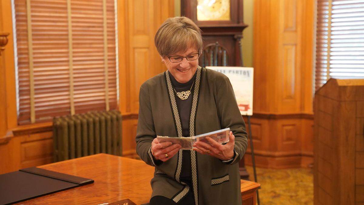 Kansas Gov. Laura Kelly’s staff thought it was time for her to “drop everything now” and give Taylor Swift’s music “a proper listen.” So they made her a personalized CD.