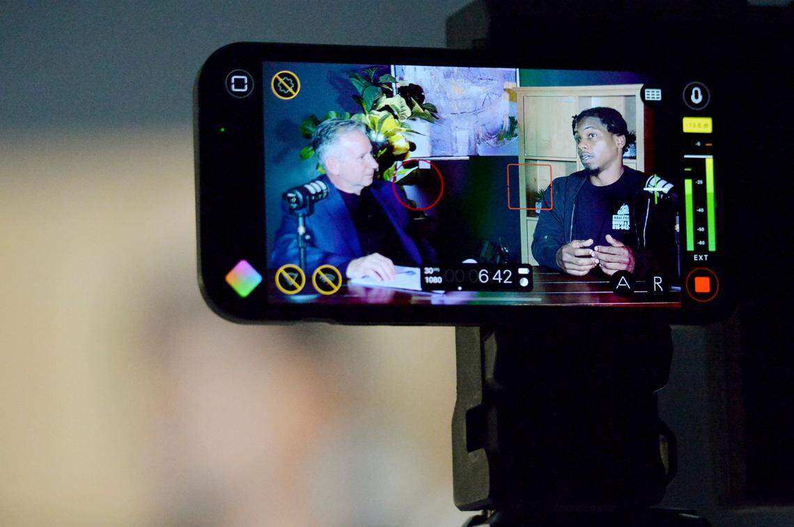 Antonio Hatcher, right, owner of Haul Pros, talked with Kansas City Star reporter Eric Adler, about his business in the studios of KC GIFT, a non-profit that supports black small business owners.