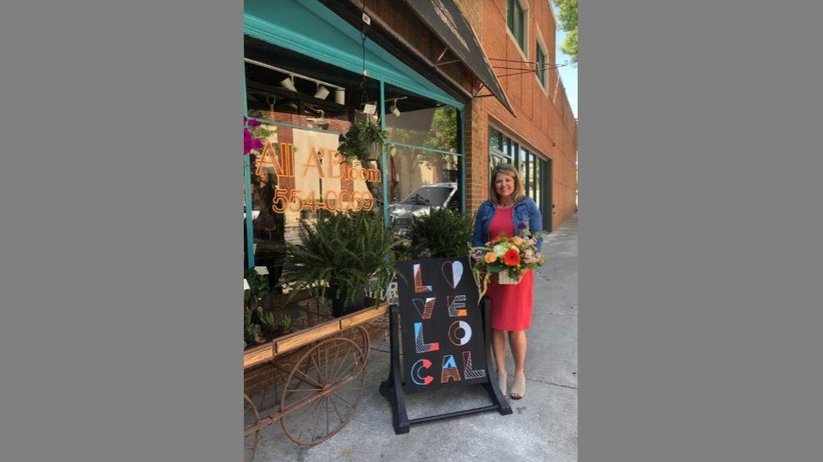 Barb Keller, owner of All A’Bloom Flowers & Gifts, loves the idea of the passport program.