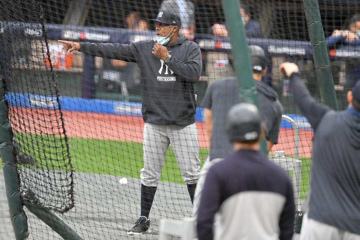 Hitting coach Marcus Thames #62 of the New York Yankees talks to his players prior to Game One of the American League Wild Card Series against Cleveland at Progressive Field on September 29, 2020 in Cleveland, Ohio.