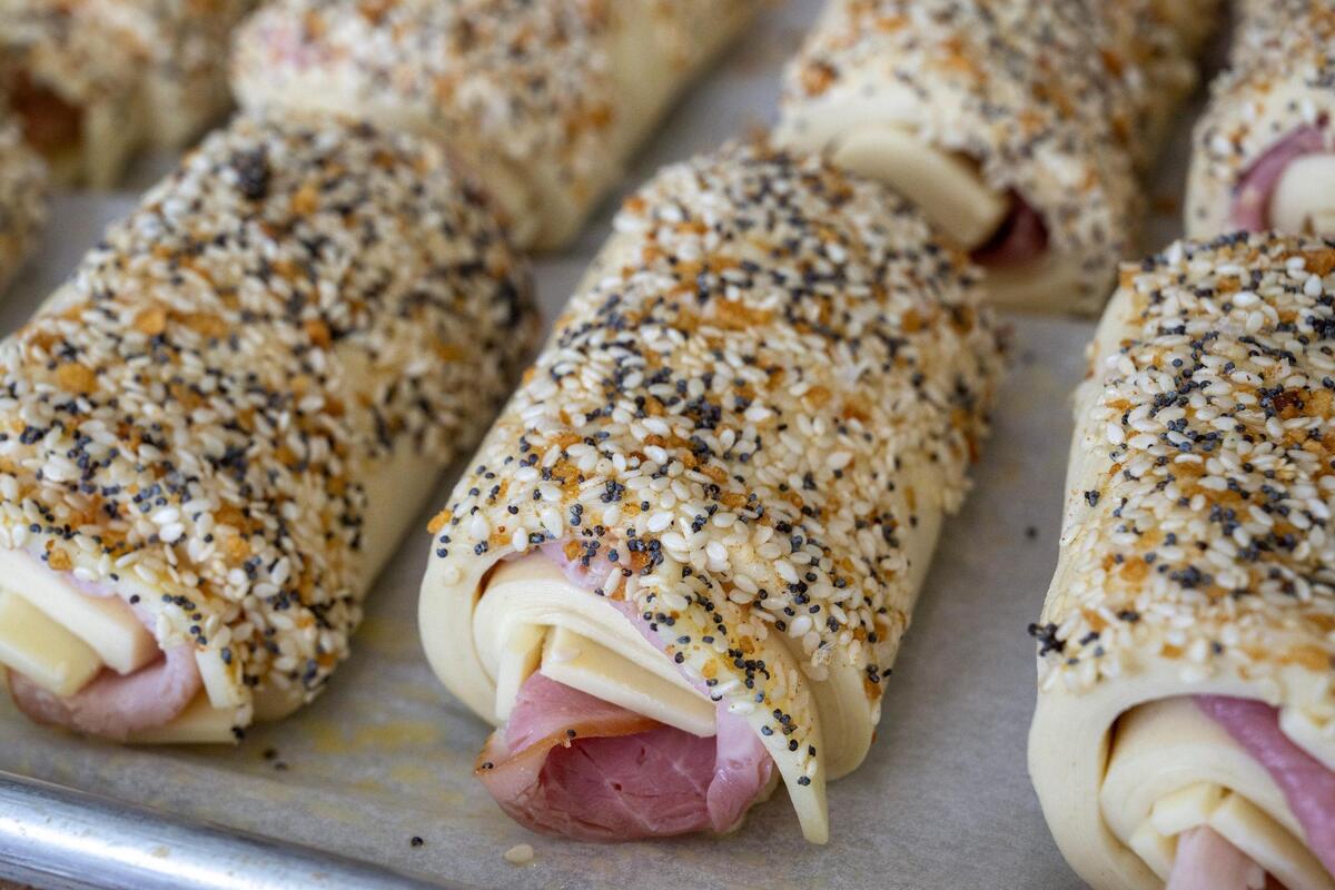 Unbaked ham and cheese croissants rest on a pan at Taylor’s Donuts, ready to be put in the oven and then brought over to 1900 Barker.