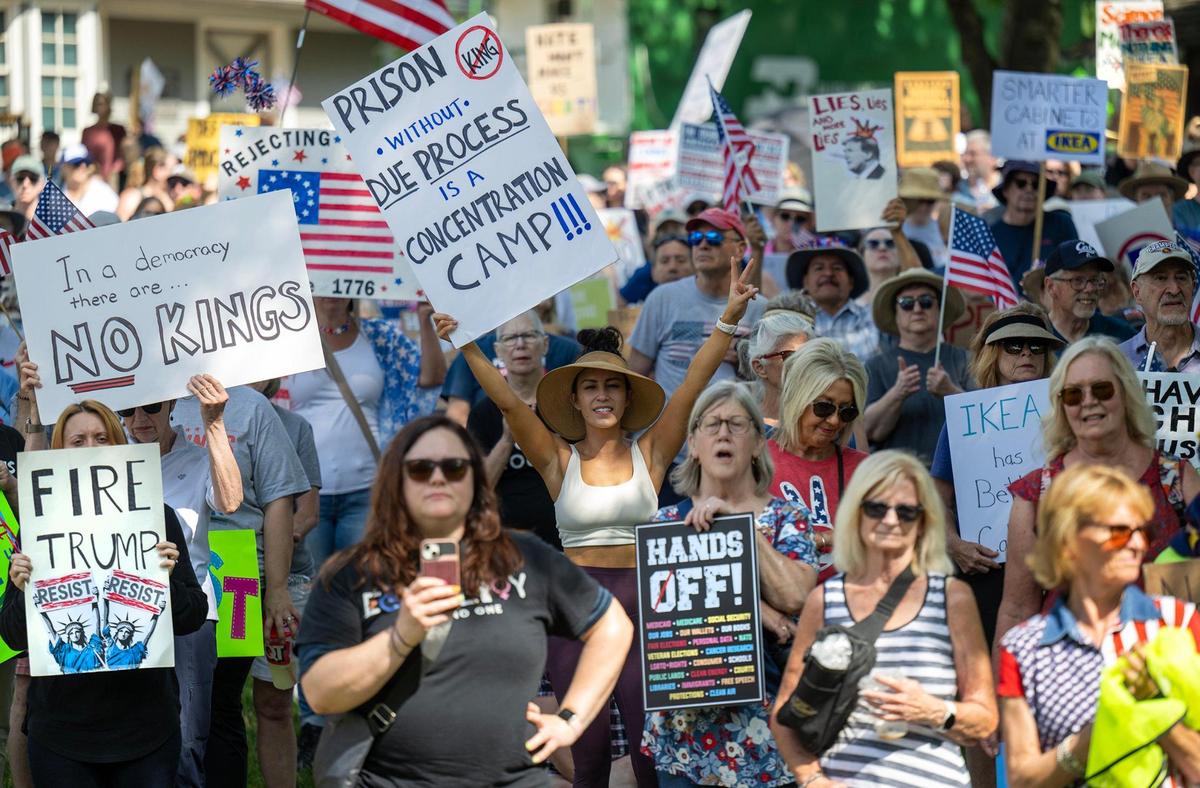 Protesters gathered and listened to speakers as they rallied at Sar-Ko-Par Trails Park during a nationwide “No Kings” day of defiance on Saturday, June 14, 2025, in Lenexa, Kansas. The events protest President Donald Trump and immigration policies, among other issues.