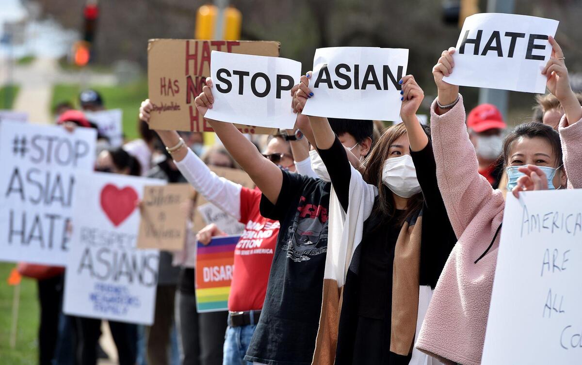 Nearly 150 people attended a rally at Highland Plaza on 119th Street in Overland Park Saturday, March 27, 2021, to bring attention to hate crimes committed against Asian people. A newly formed group, Allies Against Asian Hate, organized the event.