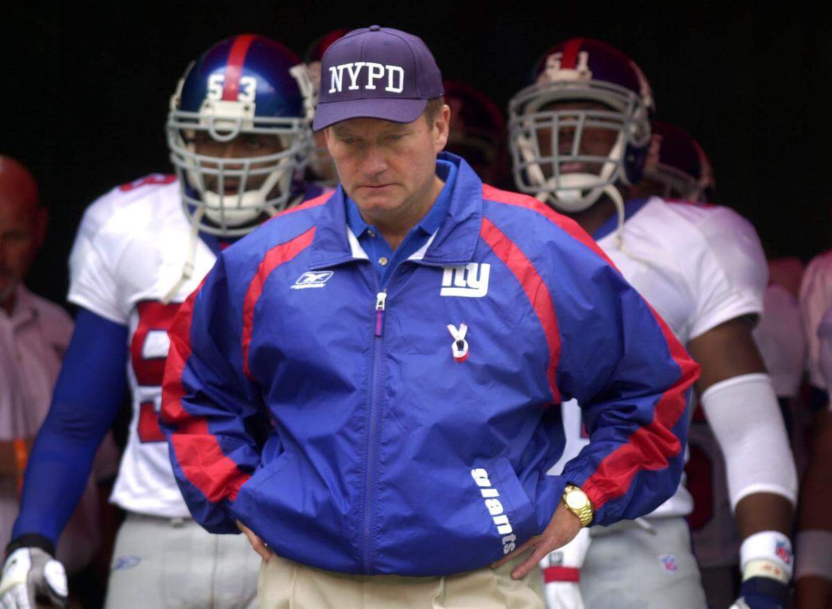 New York Giants coach Jim Fassell wore a hat honoring the New York Police Department during the Chiefs-Giants game on Sept. 23, 2001 at Arrowhead Stadium.