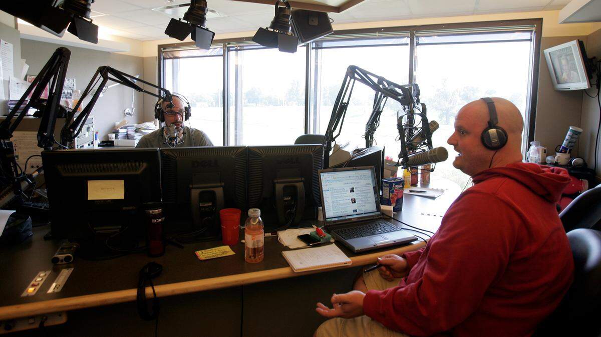 Radio host Lazlo, right, in action during “The Church of Lazlo,” on the station then called 96.5 The Buzz.