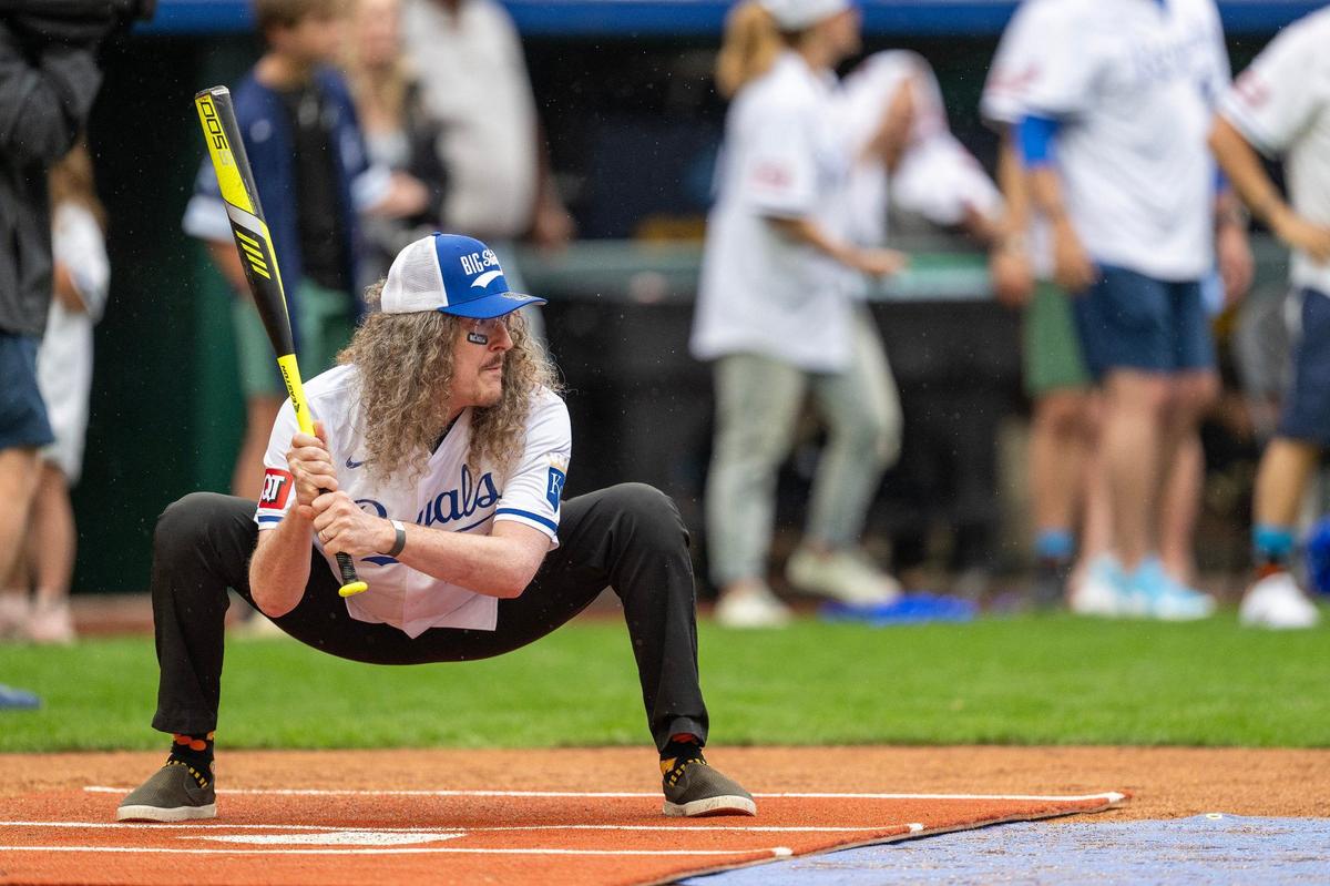 Comedian Al Yankovic gets low to the ground while waiting for a pitch during the Big Slick celebrity softball game at Kauffman Stadium on Friday, May 31, 2024, in Kansas City.