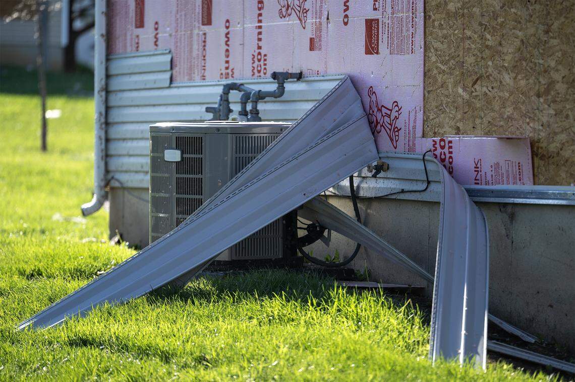 Siding was ripped from a townhouse on Conti Court near 173rd Street in Belton and was was visible Saturday, April 18, 2026, after a tornado touched down in the area Friday night.