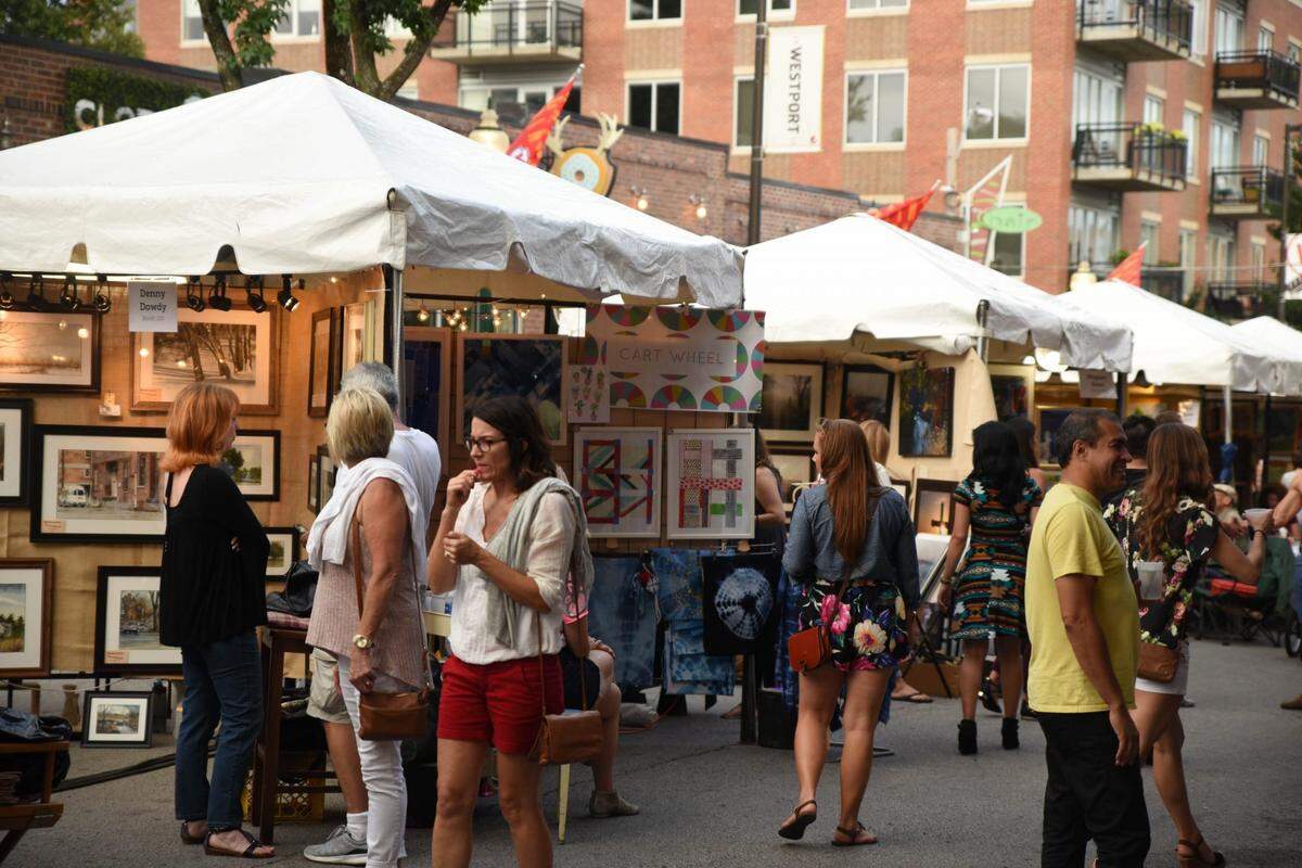 Kansas City visitors walking through Art Westport. The art fair returns for its 42nd year this weekend.