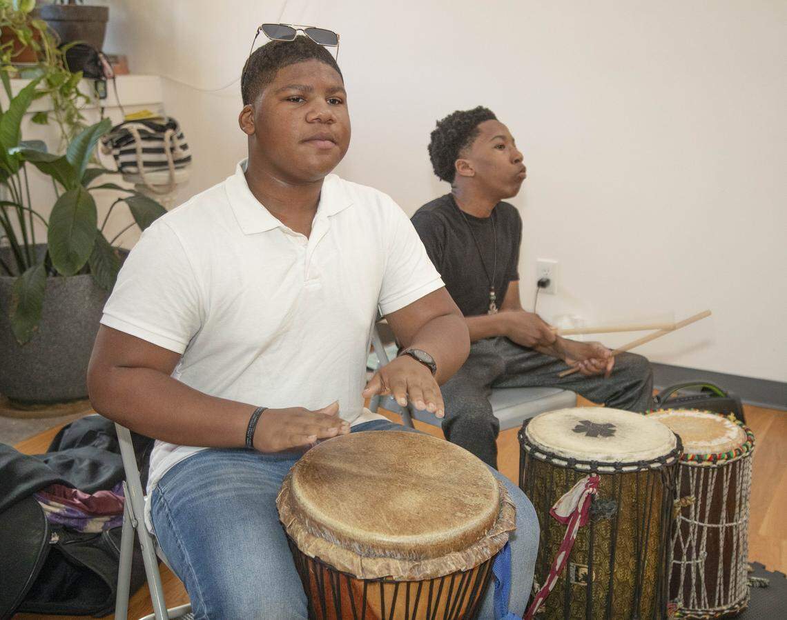 Shymir Williams, 13 (left) and Hashim Muhammad, 14, played the drums during an Art in Motion African dance and drum class Saturday, October 11, 2025 at Inner Space, 2711 Troost Ave. in Kansas City.
