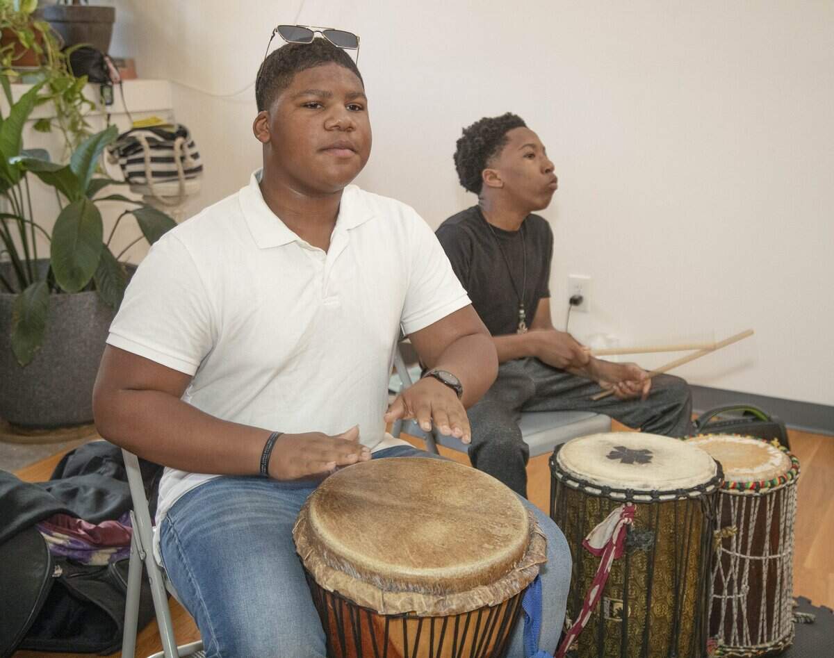 Shymir Williams, 13 (left) and Hashim Muhammad, 14, played the drums during an Art in Motion African dance and drum class Saturday, October 11, 2025 at Inner Space, 2711 Troost Ave. in Kansas City.