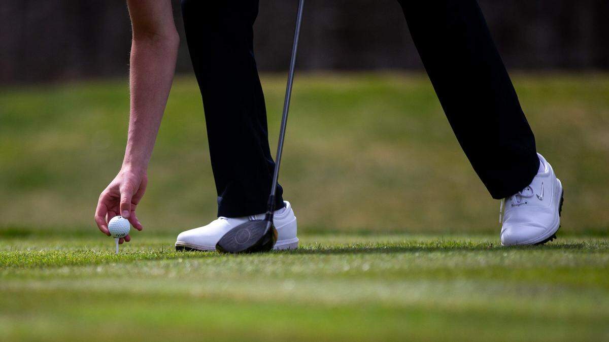 A golf ball is placed on a tee at a high school golf invitational held in Michigan in April 2023.