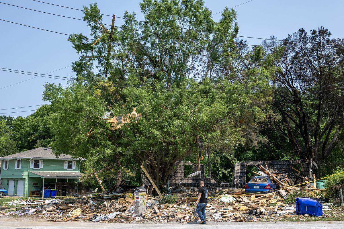 Debris is seen scattered across the site of a home explosion on Sunday, June 1, 2025, in Gladstone. The blast the day before killed one person and damaged nearby homes. Officials later determined the cause to be from fireworks. 