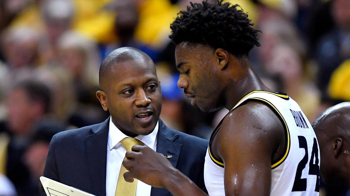 MU coach Dennis Gates chats with Kobe Brown during the first half of Saturday’s game against Kansas at Mizzou Arena (Dec. 10, 2022).
