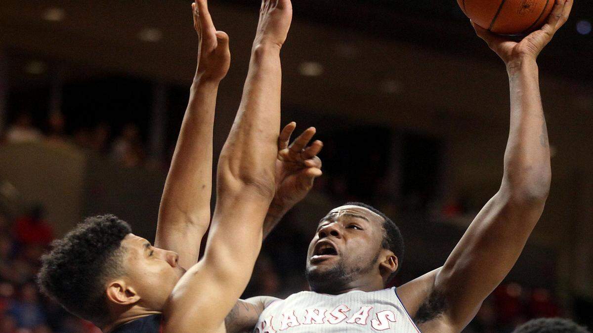 Kansas' Cliff Alexander shoots against Texas Tech's Isaiah Manderson during a NCAA college basketball game in Lubbock, Texas, Tuesday, Feb. 10, 2015. 