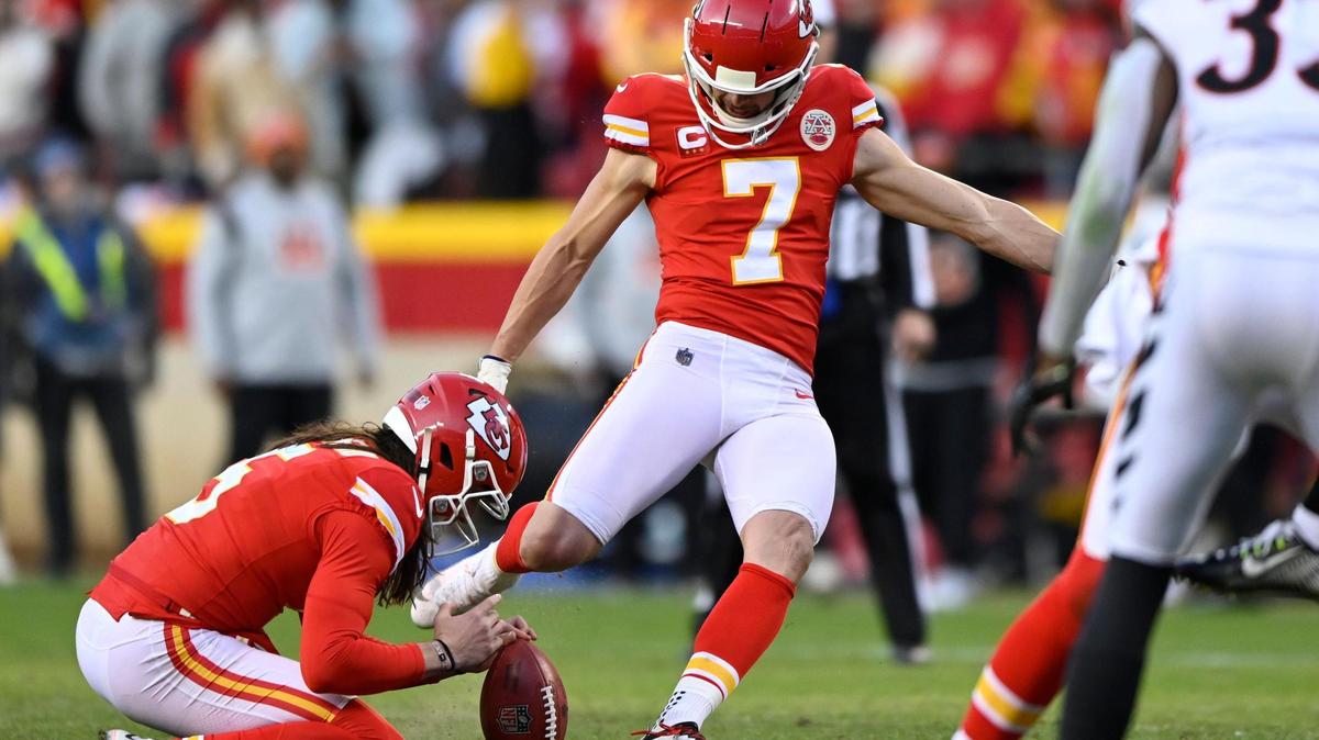 Kansas City Chiefs punter Tommy Townsend (5) with the hold as Chiefs kicker Harrison Butker (7) kicks a field goal to tie the game and send it to overtime during the second half of the AFC Championship game on Sunday, Jan. 30, 2022, at Arrowhead Stadium in Kansas City.