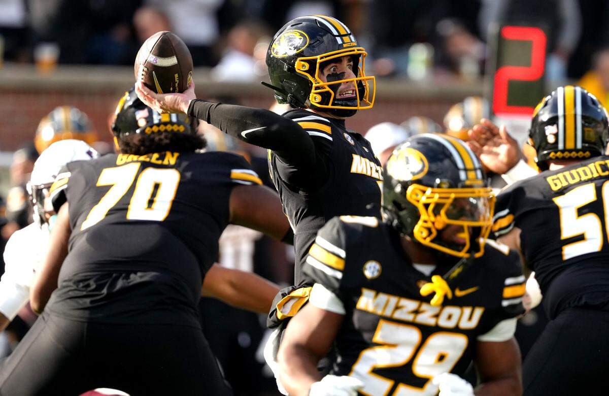 Matt Zollers #5 of the Missouri Tigers passes against the Texas A&M Aggies in the first half at Faurot Field at Memorial Stadium on November 8, 2025 in Columbia.