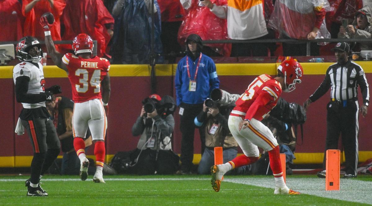 Kansas City Chiefs running back Samaje Perine (34) celebrates after catching a pass for touchdown while quarterback Patrick Mahomes (15) hobbles injured to the sideline in the fourth quarter against the Tampa Bay Buccaneers on Monday, Nov. 4, 2024, at GEHA Field at Arrowhead Stadium.