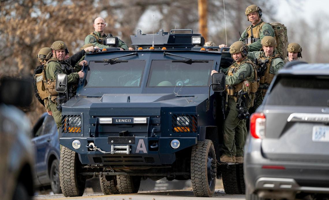Missouri Highway Patrol SWAT team members leave the scene of a standoff in the 2300 block of Blue Ridge Boulevard on Wednesday, March 1, 2023, in Kansas City.