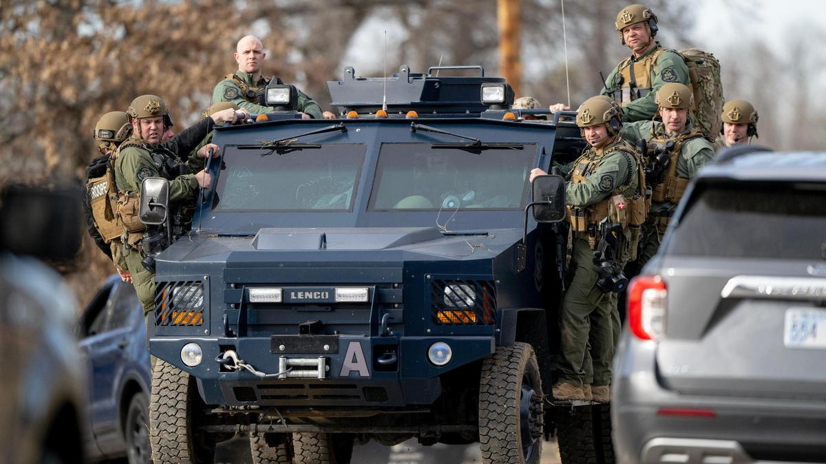 Missouri Highway Patrol SWAT team members leave the scene of a standoff in the 2300 block of Blue Ridge Boulevard on Wednesday, March 1, 2023, in Kansas City.