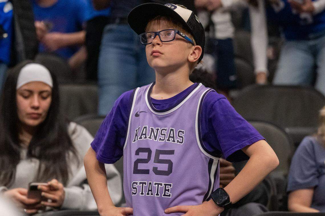 A Kansas State Wildcats fan looks at the scoreboard following the Wildcats first round loss vs. the BYU Cougars in the Big 12 Men's Basketball Tournament, on Tuesday, March 10, 2026, at T-Mobile Center. The Wildcats lost to BYU, 105-91.