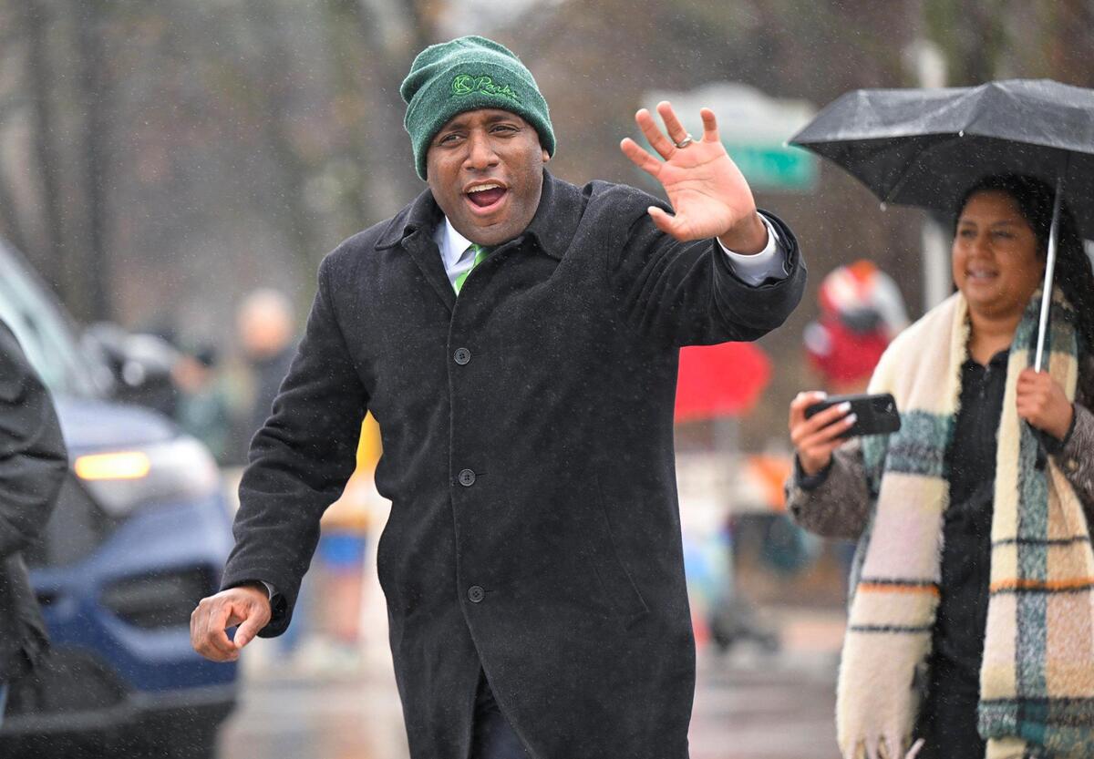 Rain didn’t dampen the festivities during the 2023 Brookside St. Patrick’s Day Warm-Up Parade where Kansas City Mayor Quinton Lucas jogged through the street on Saturday March 11, 2023 in Kansas City.