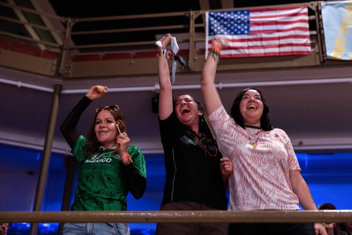 Mother, Irma, left, and daughters, Amanda and Samantha Ramirez cheer after Mexico scores the first goal of the game at the KCK Mexico v. South Africa Watch Party hosts at Memorial Hall on Thursday, June 11, 2026.