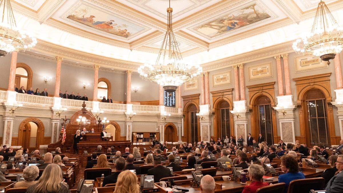 Members of the Kansas Legislature fill in to the House Chambers Wednesday to listen to Gov. Laura Kelly give her State of the State address.