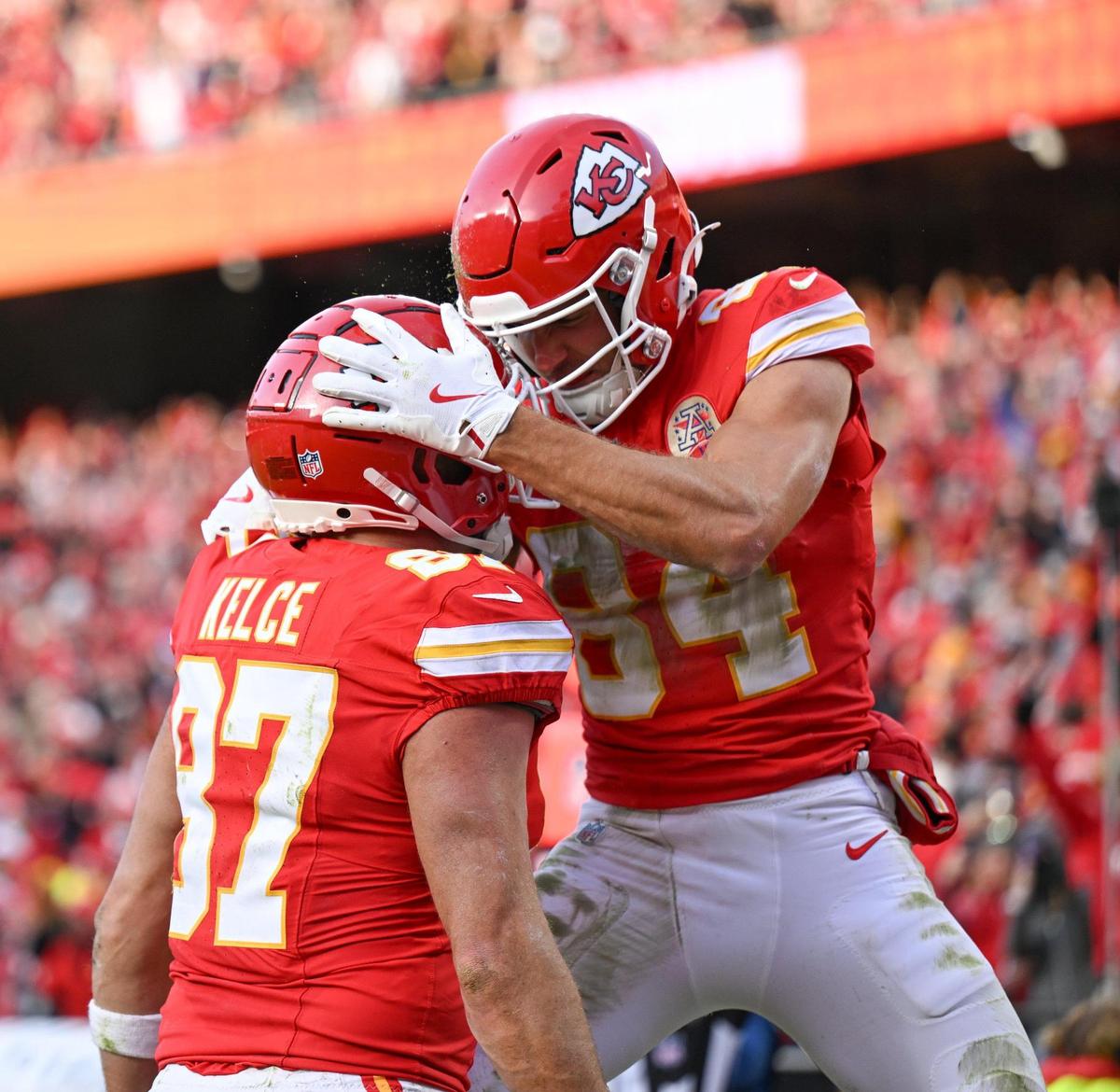 Kansas City Chiefs wide receiver Justin Watson (84) celebrates catching a pass for a touchdown with tight end Travis Kelce (87) in the first half agains the Las Vegas Raiders on Friday, Nov. 29, 2024, at GEHA Field at Arrowhead Stadium.