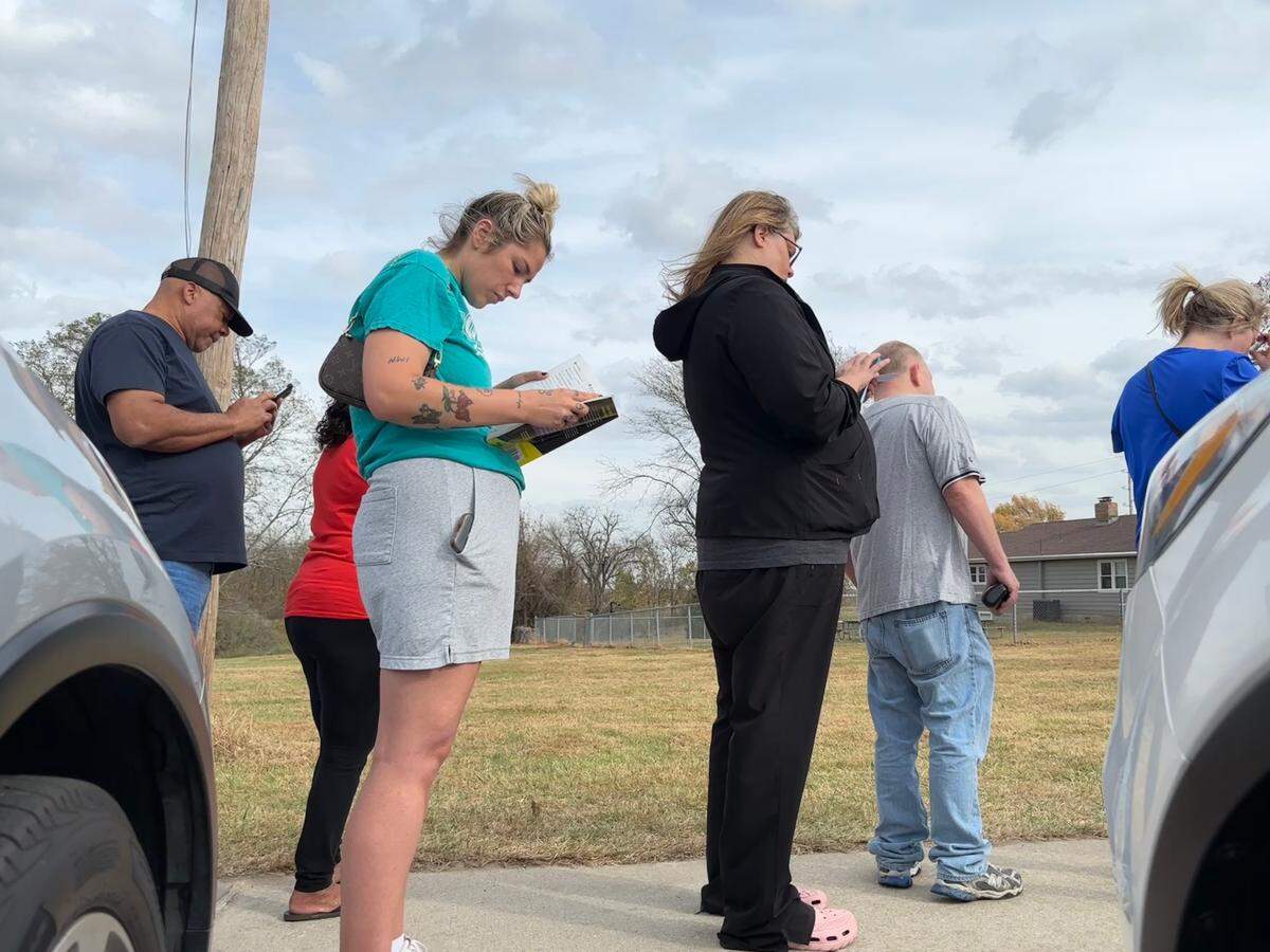 Taylor Batson read an anatomy and physiology textbook while waiting to vote early in Blue Springs. On the Tuesday afternoon, Jackson County residents waited for approximately two hours to cast their ballots.
