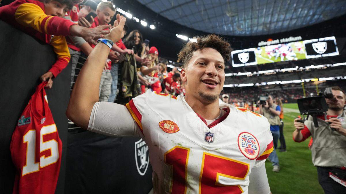 Chiefs quarterback Patrick Mahomes meets with fans before leaving the Allegiant Stadium field after Sunday’s win in Las Vegas against the Raiders.