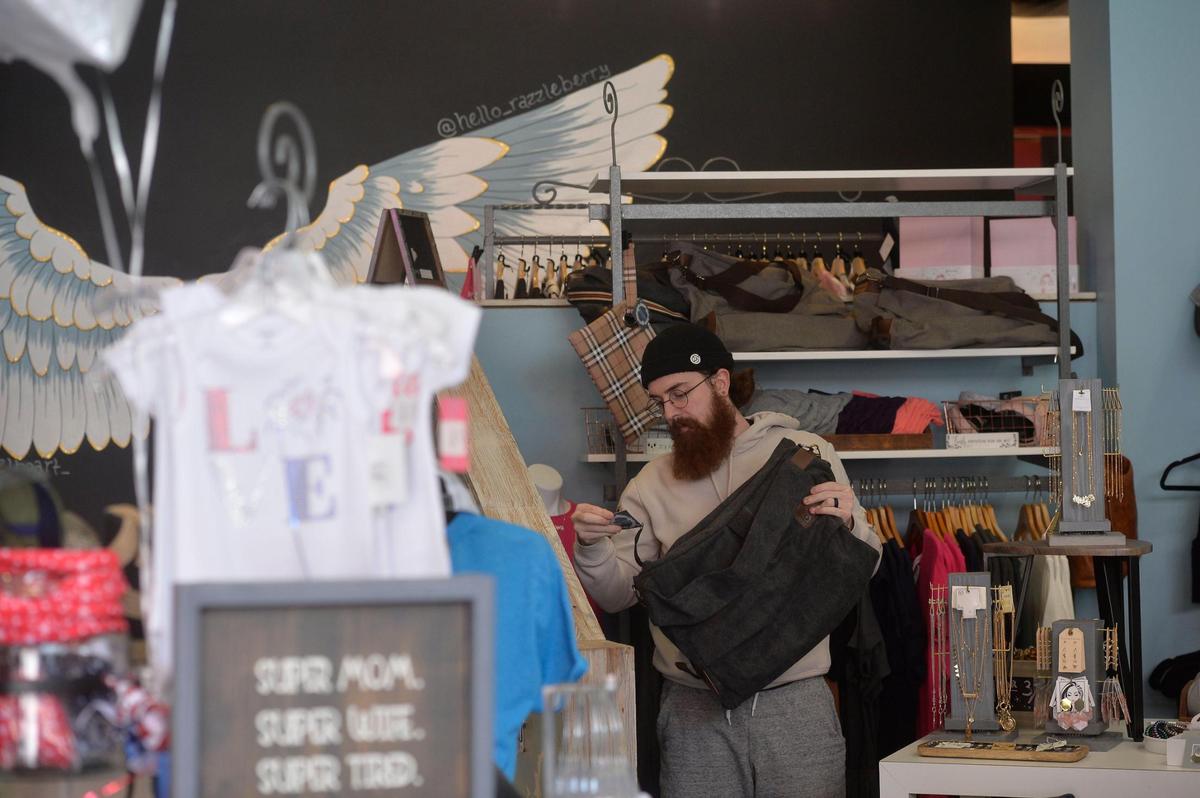Austin Bringenberg manages Razzleberry on the Country Club Plaza. His mother, Amy Bringenberg, owns the shop.