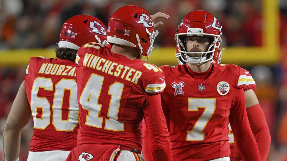 Kansas City Chiefs place kicker Harrison Butker (7) and Kansas City Chiefs long snapper James Winchester (41) celebrate a field goal that tied the game in the second half of the game against the Denver Broncos at GEHA Field at Arrowhead Stadium on Thursday, Dec. 25, 2025.
