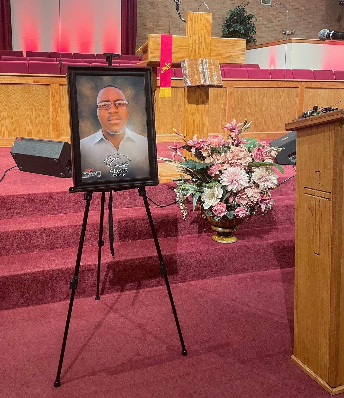 A portrait of Charles Adair stands at the altar of Friendship Baptist Church in Kansas City, Missouri on Sept. 23, 2025.
