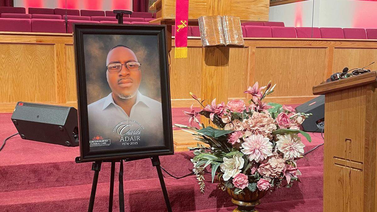 A portrait of Charles Adair stands at the altar of Friendship Baptist Church in Kansas City, Missouri on Sept. 23, 2025.