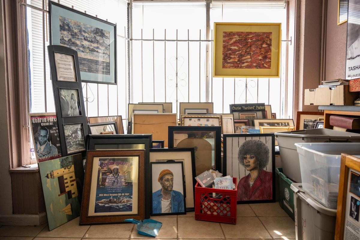 Framed art in a corner of Willa’s Books & Vinyl in Kansas City on Thursday, July 10, 2025. Willa’s will close on Saturday as the owner, Willa Robinson goes into retirement.