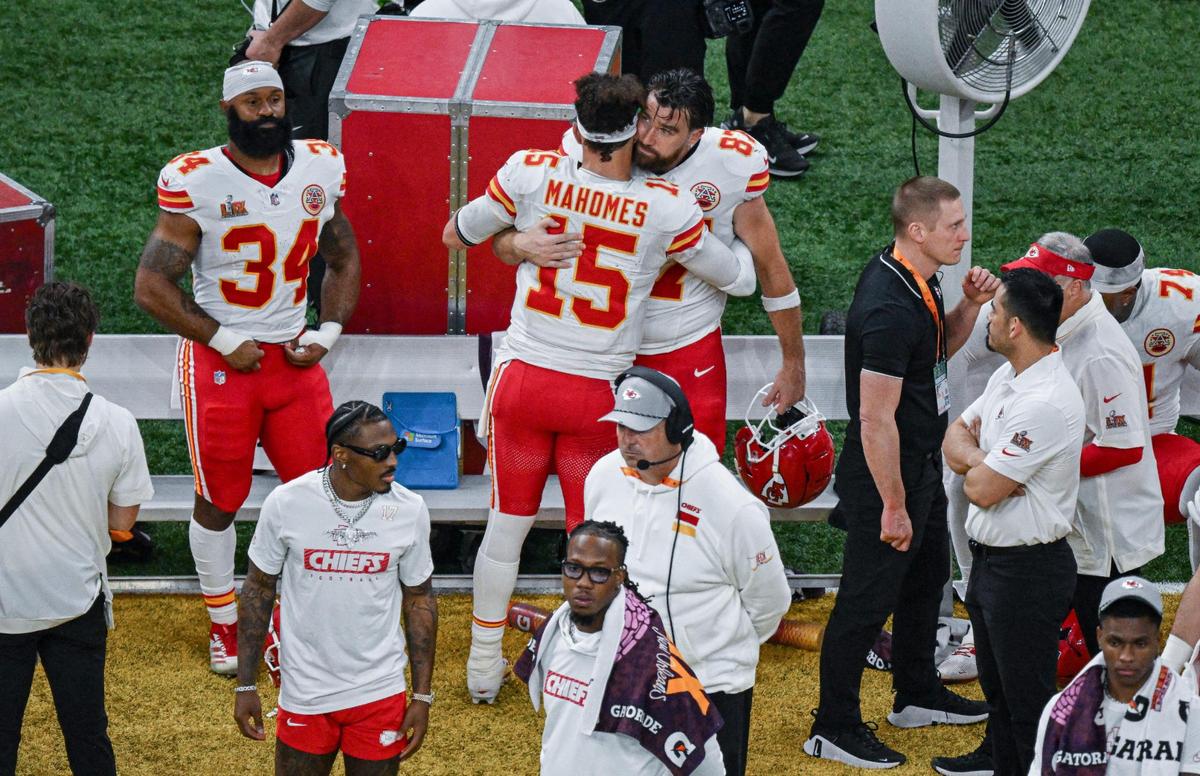 Kansas City Chiefs quarterback Patrick Mahomes (15) hugs tight end Travis Kelce (87) after the Chiefs lost to the Philadelphia Eagles 40-22 in Super Bowl LIX on Sunday, Feb. 9, 2025, in New Orleans.