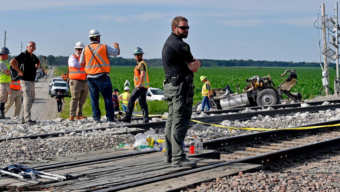 Several cars of an Amtrak train traveling from Los Angeles to Chicago derailed Monday afternoon after it struck a dump truck at a crossing in northern Missouri, Amtrak announced. More than 200 people were on board the train at the time of the crash, which was first reported about 12:43 p.m. near Mendon, Missouri, according to the Missouri State Highway Patrol. Three people were killed in the crash, the patrol said, including two people on the train and one person in the dump truck. Investigators looked over the intersection where the remains of the truck came to rest.
