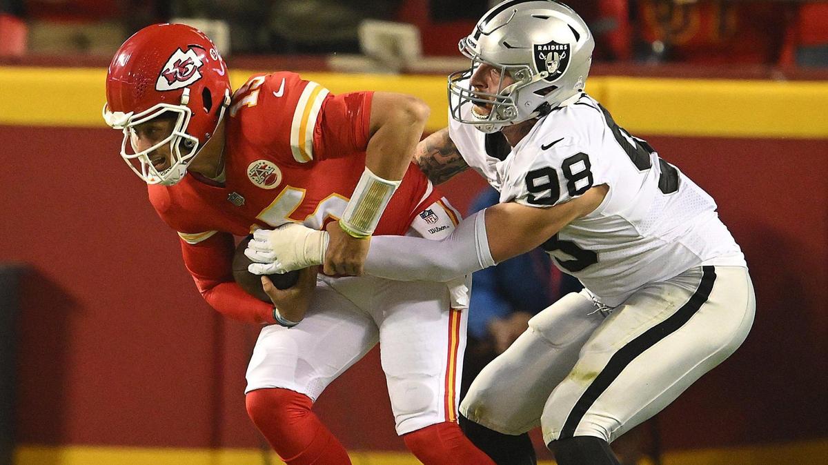 Chiefs quarterback Patrick Mahomes is sacked by Las Vegas’ Maxx Crosby during the first quarter of Monday night’s game at Arrowhead Stadium.