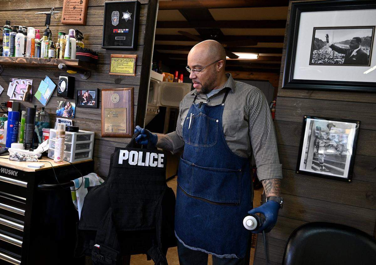 David Davis was an officer with the Kansas City Police Department from 2004 to 2018. He told The Star that a supervisor called him a racial slur. Davis left the force and now owns Double Ds Barbershop in Leavenworth, Kansas. Davis still has his police vest.