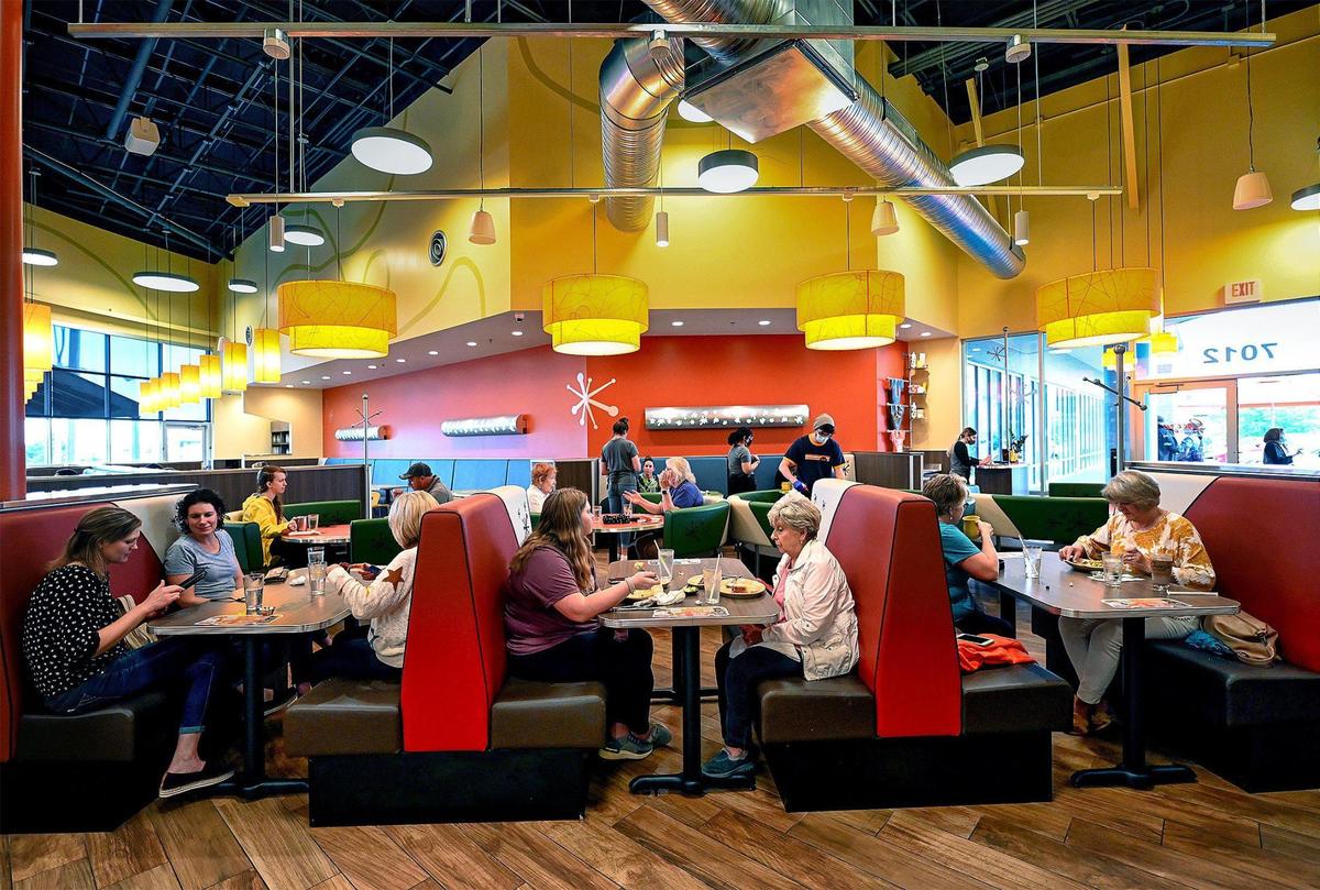 Customers dine mid-morning at Snooze an A.M. Eatery, 7012 W. 135th St., in Overland Park.