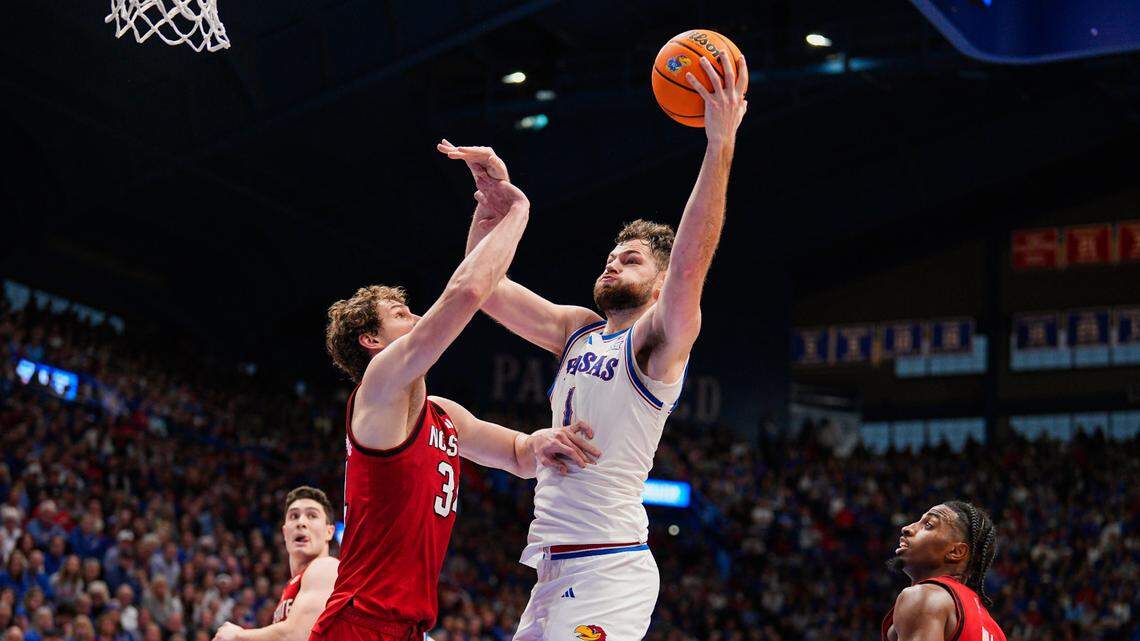 Kansas Jayhawks center Hunter Dickinson (1) shoots the ball against North Carolina State Wolfpack forward Ben Middlebrooks (34) during the second half at Allen Fieldhouse on Dec. 14, 2024.