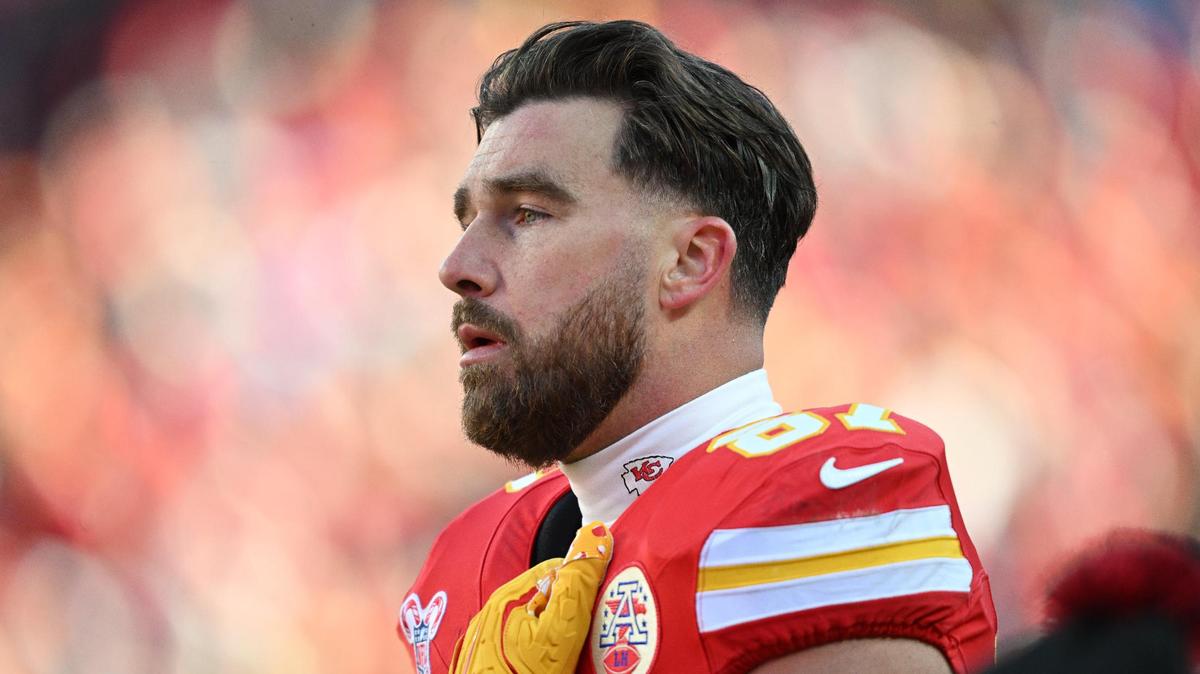 Kansas City Chiefs tight end Travis Kelce (87) watches with concern while medical personnel tend to Houston Texans wide receiver Tank Dell after his knee was severely injured on a touchdown catch in the third quarter on Saturday Dec. 21, 2024, at GEHA Field at Arrowhead Stadium.
