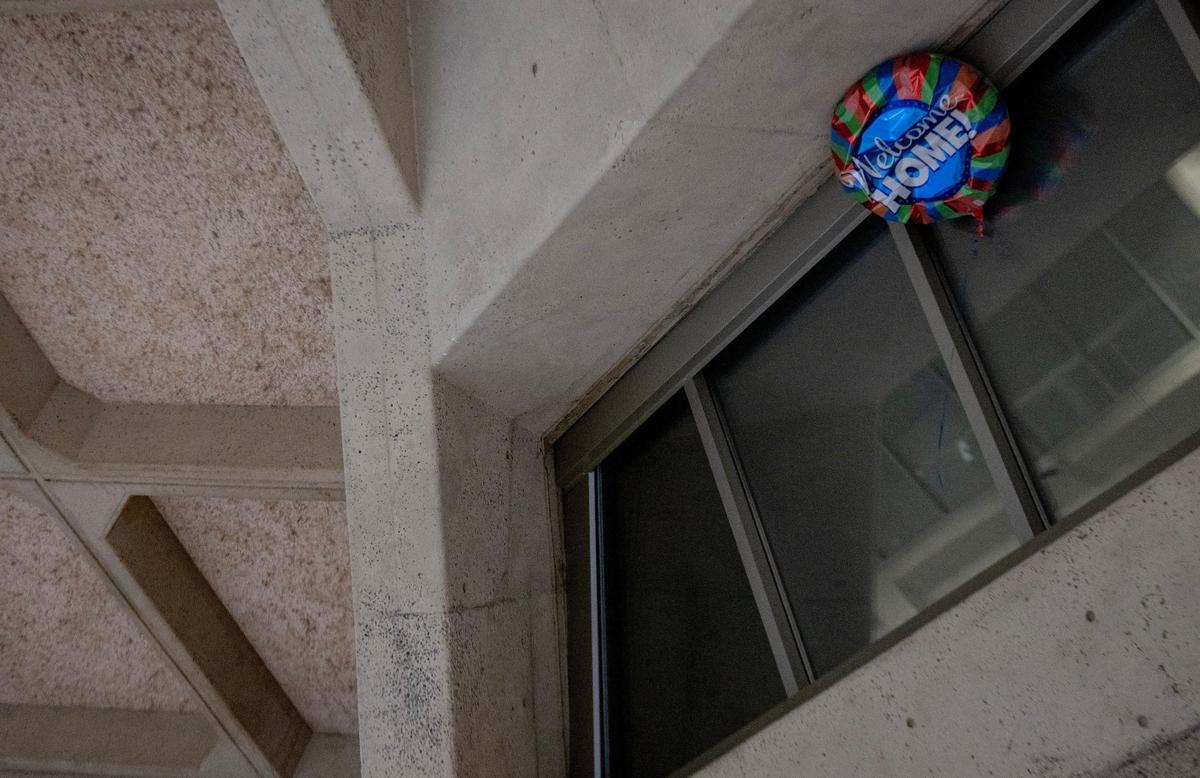 A balloon reading “Welcome Home” remains against the ceiling of terminal B on the last day of operation at Kansas City International Airport’s old terminals on Monday, Feb. 27, 2023, in Kansas City.