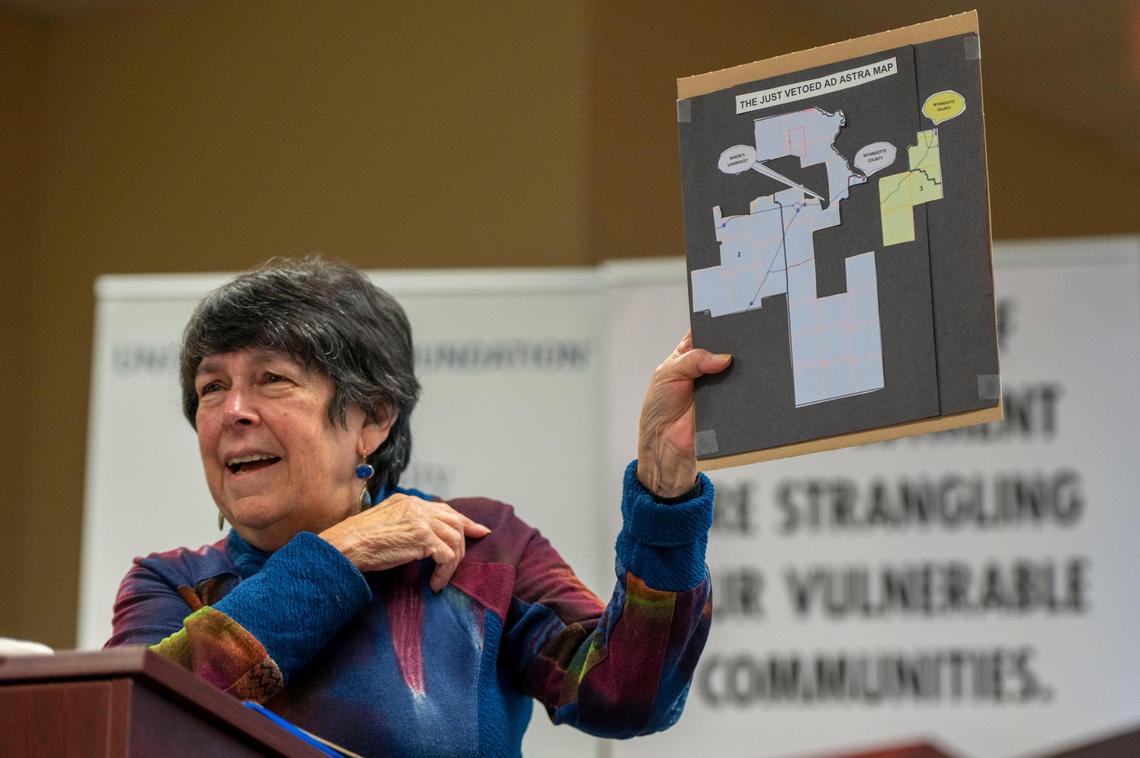 President of Cross Border Network, Judy Ancel, shows a visual of the Ad Astra 2 Congressional Map during a press conference at the Community Health Council of Wyandotte County in Kansas City, Kan., on Friday, Feb. 4, 2022. Community leaders are supporting Gov. Laura Kelly’s veto of SB 355 which calls for redistricting a big portion of Wyandotte County out of the 3rd Congressional District and putting it in the 2nd District.