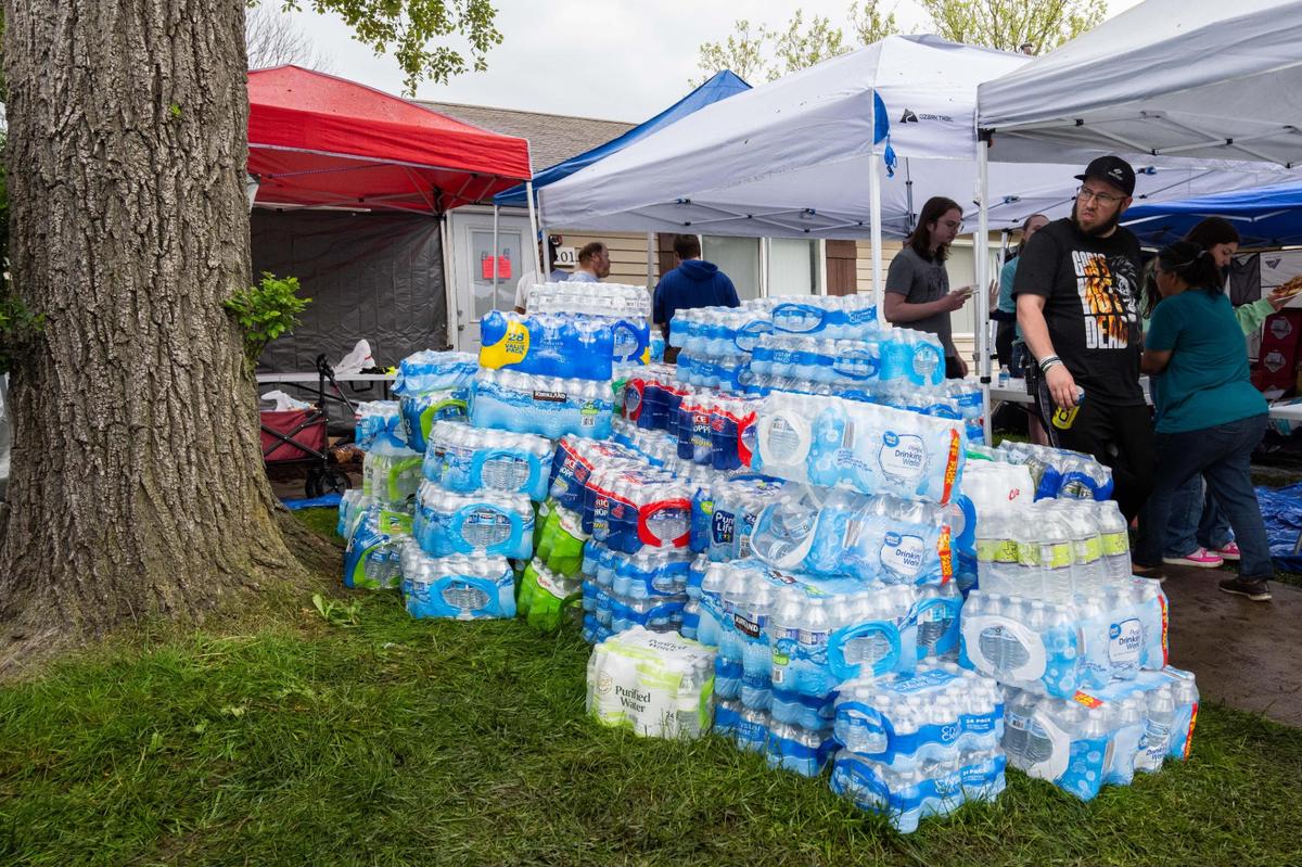 Cases of water for residents at Aspen Place Apartments in Gardner on Wednesday, May 7, 2025. People said the water has been shut off since Sunday.