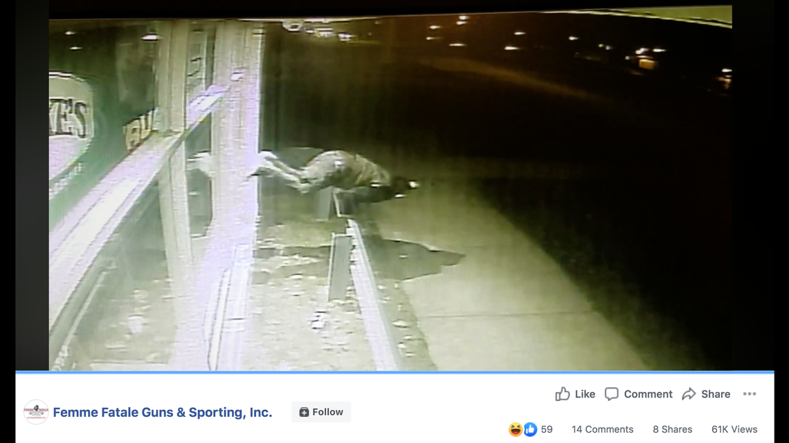 An attempted burglary suspect could not break into a South Bend, Indiana, gun shop despite body slamming himself and kicking the window, video shows. Screengrab from Femme Fatale Guns & Sporting Inc. on Facebook.
