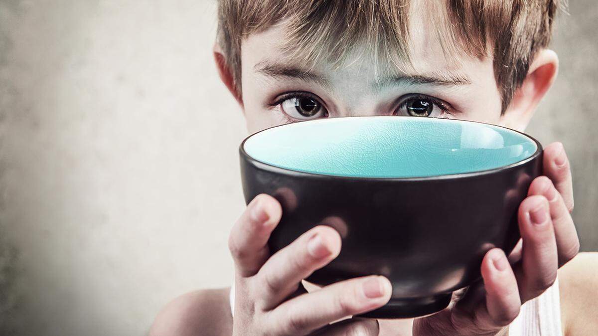 Hunger. Shallow focus hungry food insecurity poverty child children kid poor need needy