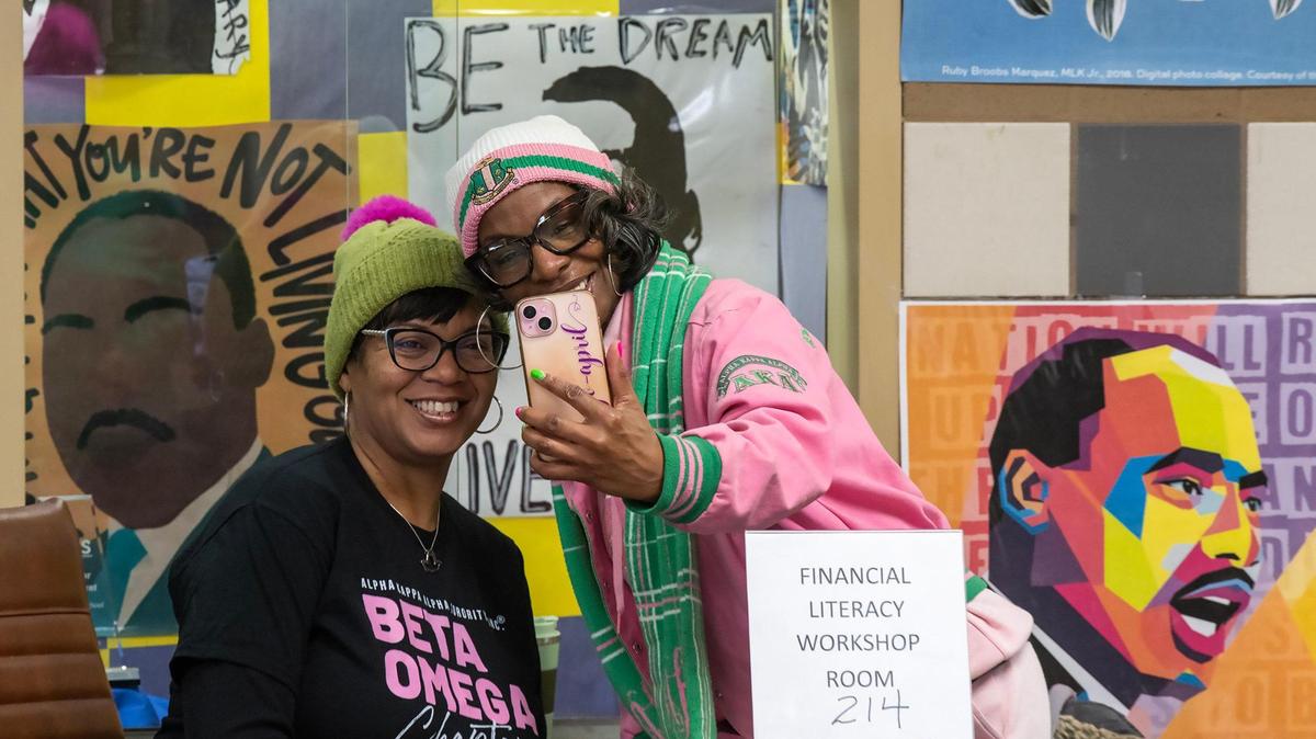 Robin Henderson, left, of Lee’s Summit and April Sutherland of Belton, took a selfie together during the We Are ONE, Alpha Kappa Alpha Day of Service at Martin Luther King Elementary School on Monday, Jan. 20, 2025, in Kansas City. Over 140 members, graduate and undergraduate of the Kansas City Metro Chapters of the AKA sorority, gathered at the school to paint, pack hygiene kits, to provide financial literacy education, and pack food bags. The women are in the Beta Omega Chapter of Kansas City.