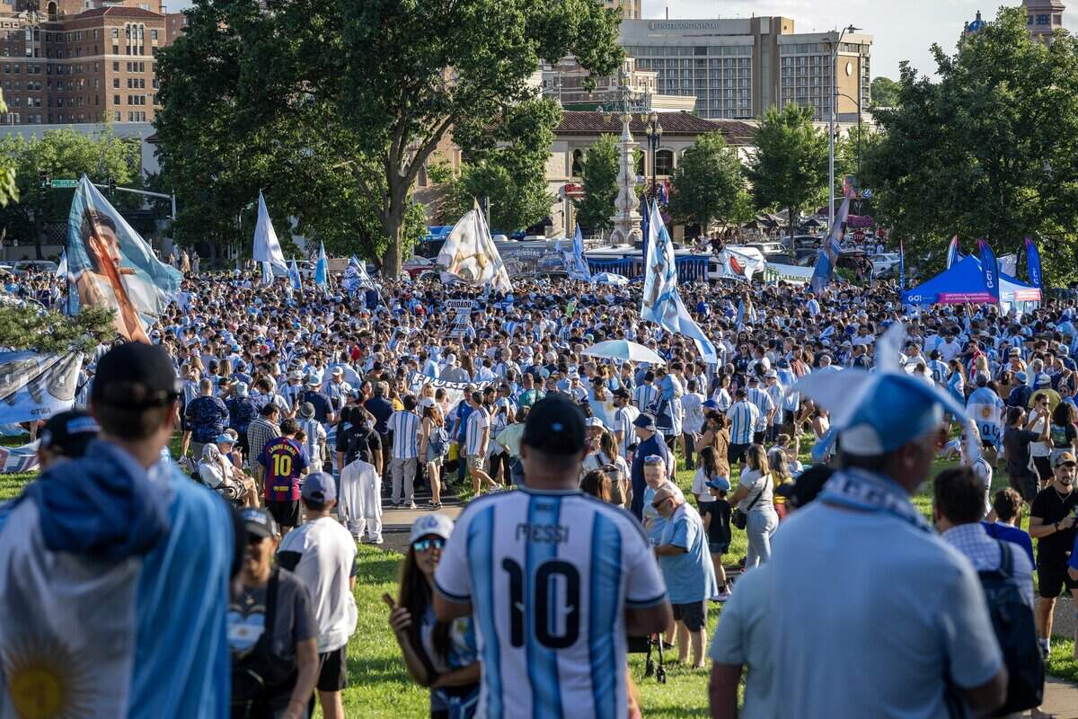 Argentina supporters celebrate during a pregame gathering ahead of Argentina's FIFA World Cup match against Algeria at Mill Creek Park on Monday, June 15, 2026, in Kansas City.
