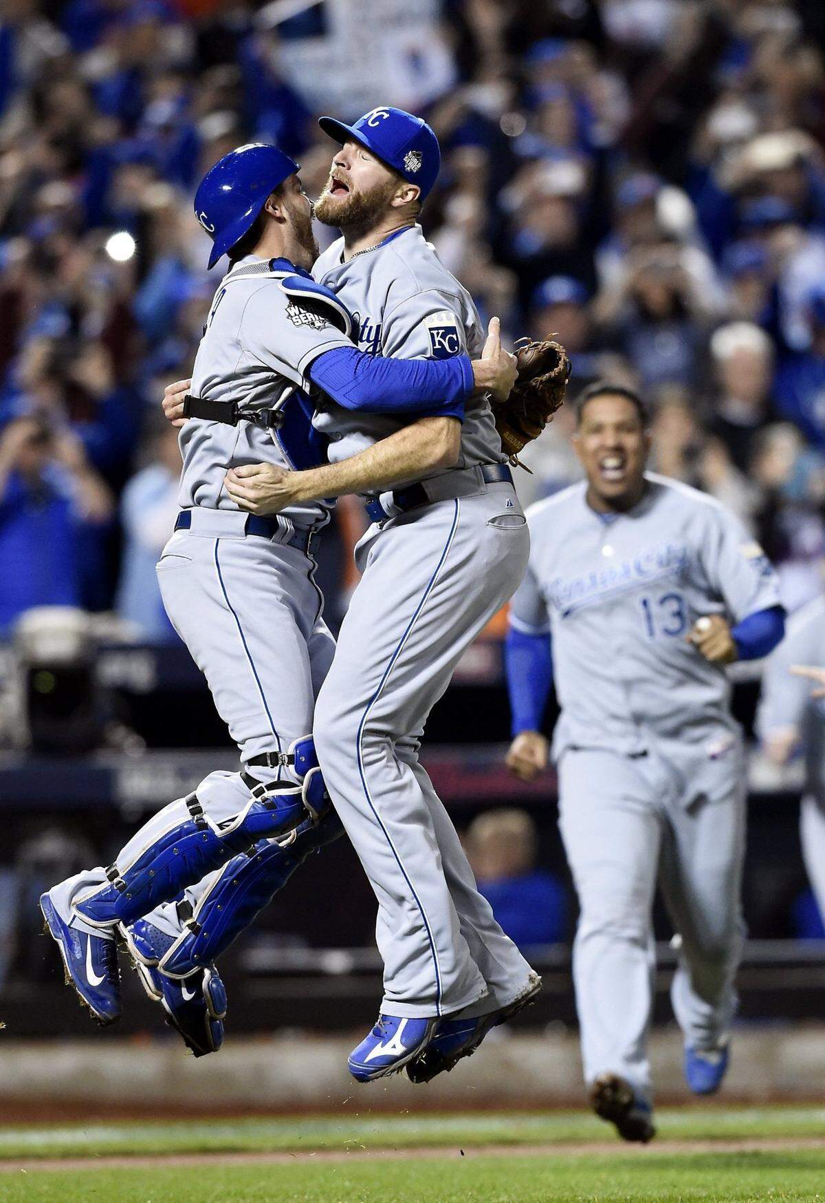 Kansas City Royals catcher Drew Butera and relief pitcher Wade Davis celebrate after winning the World Series in 2015 at Citi Field in New York. The title win topped off years of a rebuilding effort that started with the hiring of general manager Dayton Moore in 2006.